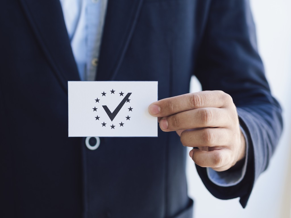front-view-man-holding-ballot.jpg